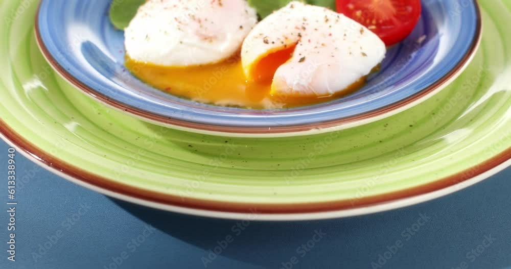 poached eggs with vegetables on a plate. sunny day. angle view. smooth zoom camera movement. poached eggs with vegetables on a plate. sunny day. angle view. smooth zoom camera movement.