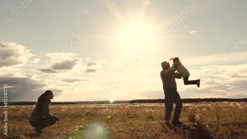 mother child father hug sunset, family happiness run, dream child girl running, mom dad hug sun, dream becoming pilot plane, road along wheat field sunset, hugging child, children parents playing