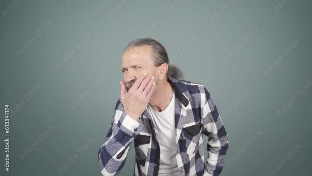 Man with wrinkles and problems on his skin is unhappy.