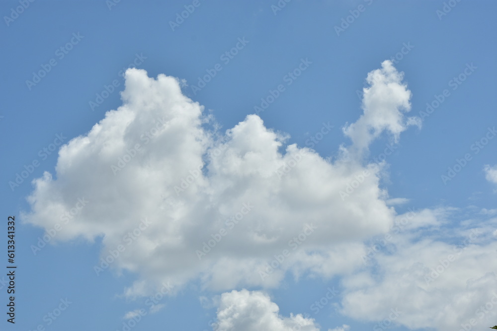 White clouds against blue sky for a backgrounds.
