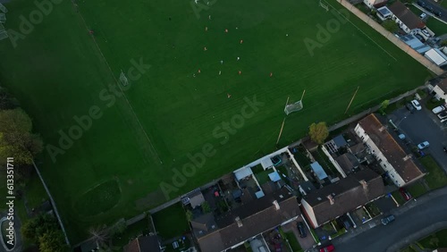 Bird's eye view . A game of hurling at a school stadium with players in Ireland photo