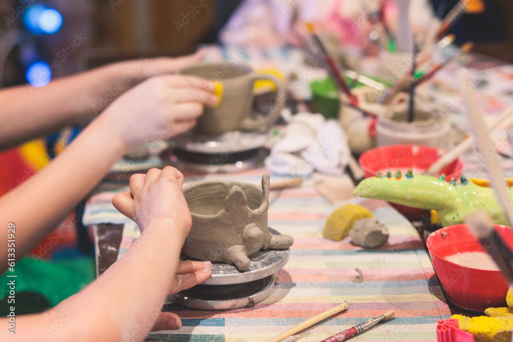 Foto de Pottery lesson master class for kids children, process of
