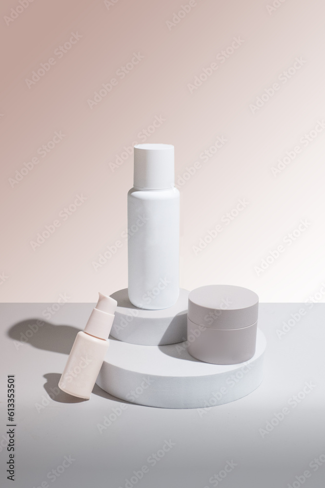 Podium of Skin Care Bottles with Pastel Background and Shadows Podium of Skin Care Bottles with Pastel Background and Shadows