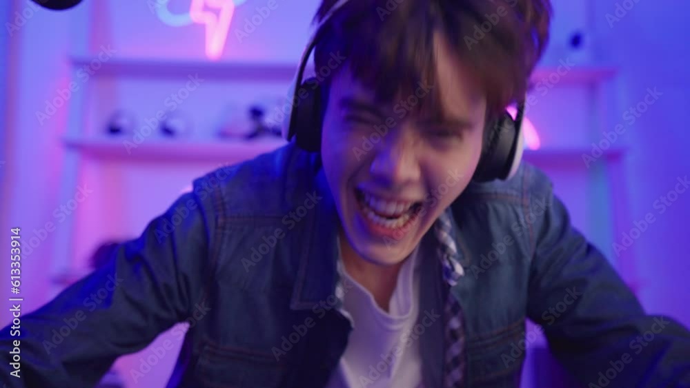 Asian attractive Esport male gamer play online video game on computer. 
