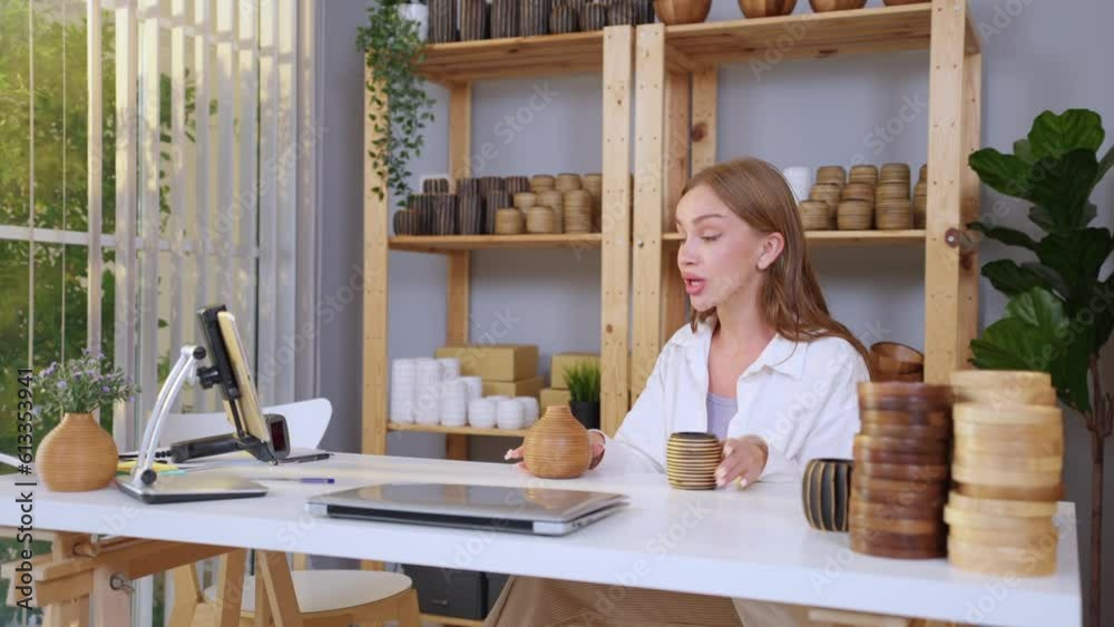 Caucasian young woman sell vase product online live streaming at home. Caucasian young woman sell vase product online live streaming at home.