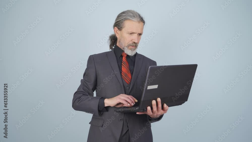 Businessman looking at laptop with excitement. Businessman looking at laptop with excitement.