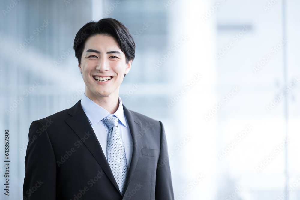 Smile for the camera of a male businessman who looks like a handsome mid-level employee. Smile for the camera of a male businessman who looks like a handsome mid-level employee.