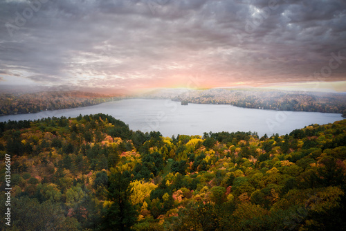 Landscape of forest fall sunset autumn colours over a lake 