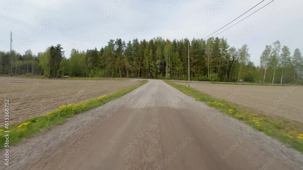 A car travels along the road, surrounded by a lush green landscape of trees. The verdant canopy creates a refreshing and tranquil environment as the car journeys through. A car travels along the road, surrounded by a lush green landscape of trees. The verdant canopy creates a refreshing and tranquil environment as the car journeys through.