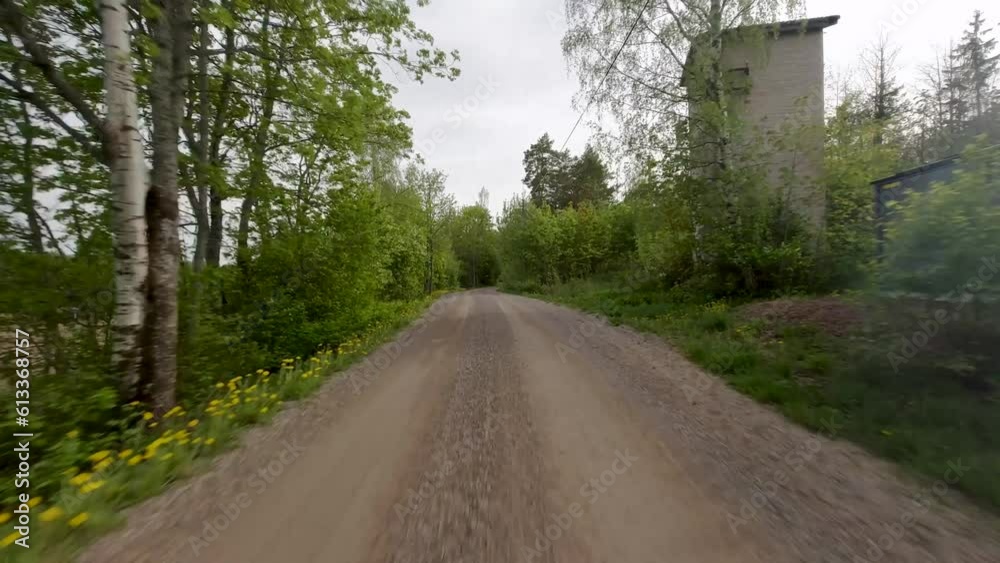 The car gracefully travels along a rural forest road, surrounded by the tranquility of nature. The winding path leads through a lush green landscape, with trees stretching their branches overhead. The car gracefully travels along a rural forest road, surrounded by the tranquility of nature. The winding path leads through a lush green landscape, with trees stretching their branches overhead.