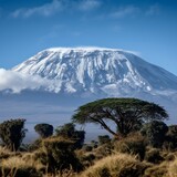 Snow-capped Peak of Kilimanjaro Above African Savannah