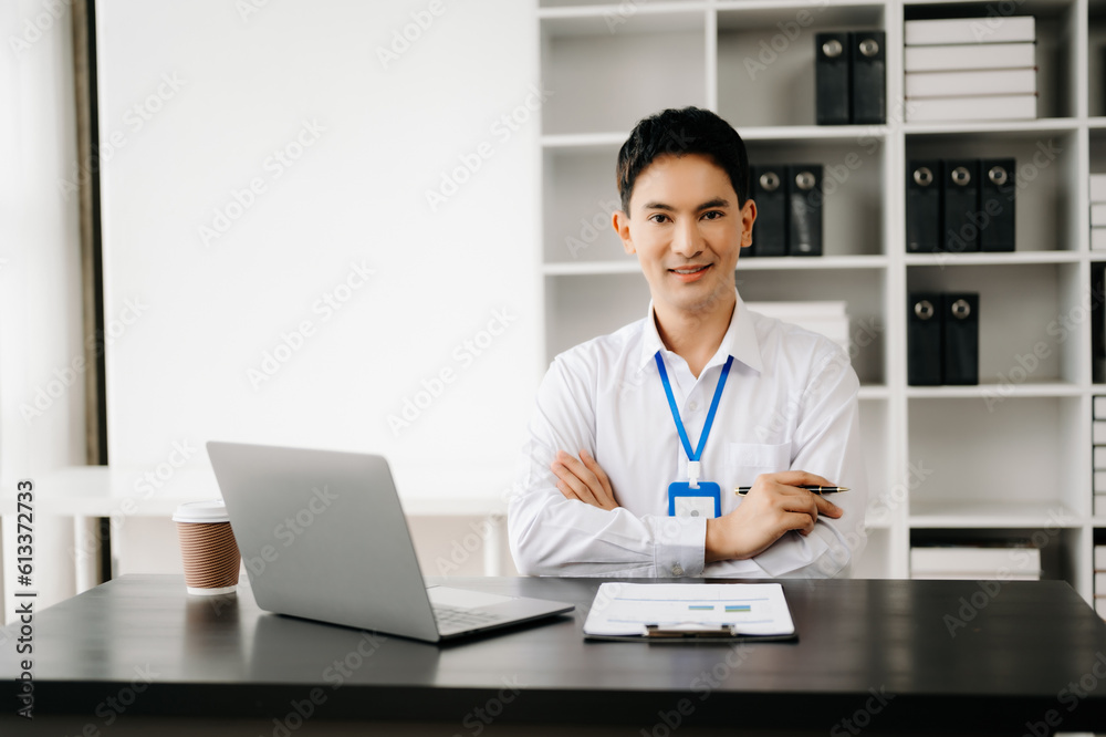 Businessman using tablet and laptop for doing math finance on an office desk, tax, report, accounting, statistics, and analytical research concept in office Businessman using tablet and laptop for doing math finance on an office desk, tax, report, accounting, statistics, and analytical research concept in office