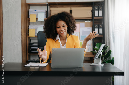 African businesswoman working in the office with working notepad  tablet and laptop documents