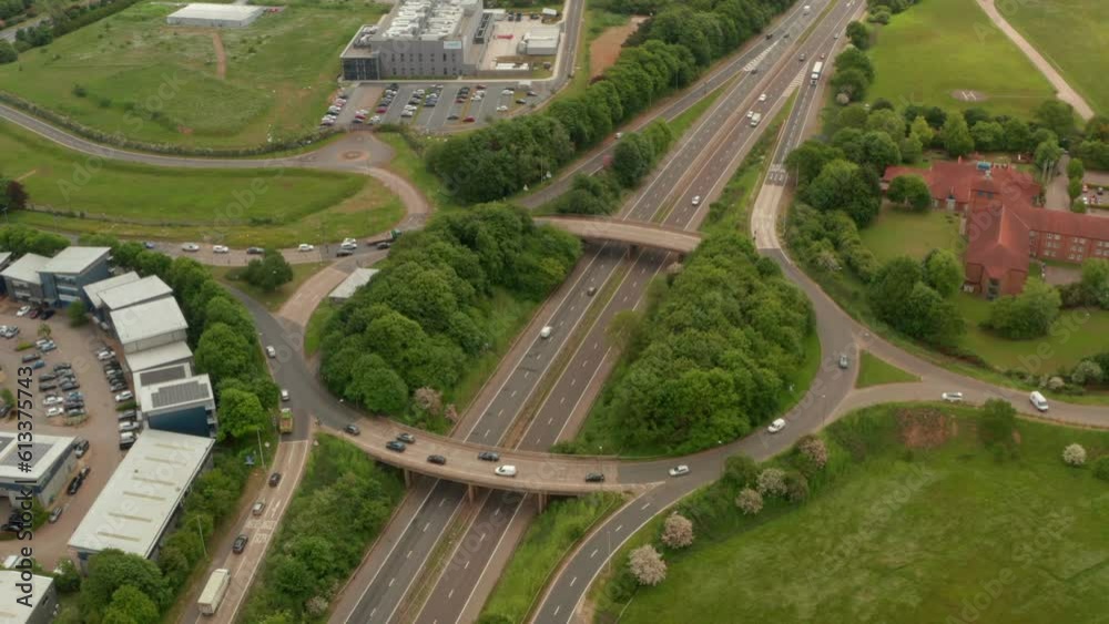 Circling aerial shot of raised road interchange over A1 Motorway UK Circling aerial shot of raised road interchange over A1 Motorway UK