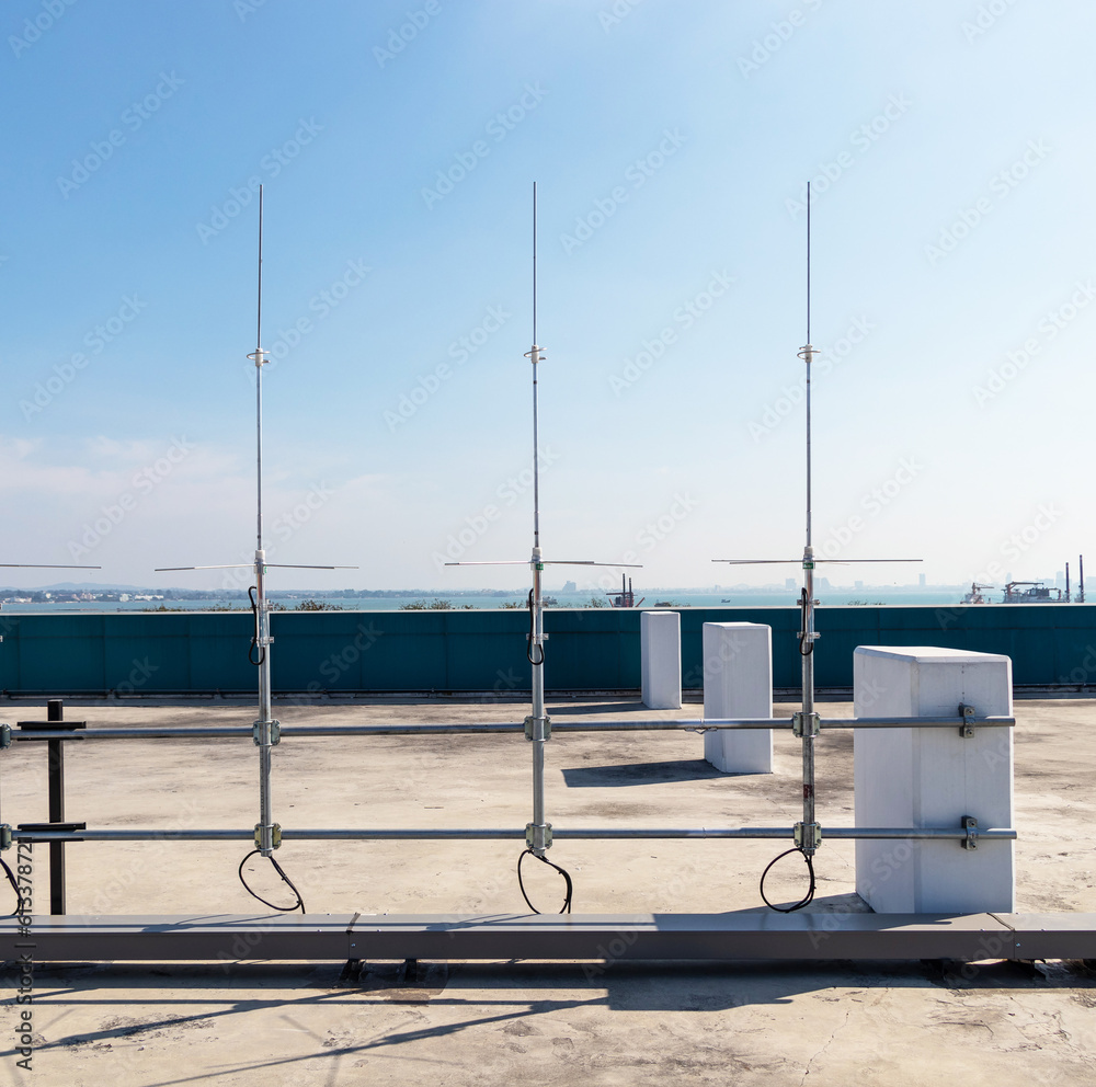 Rooftop small radio communication tower antenna and television. Is device that converts