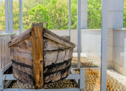 Bow of wooden lifeboat on display at museum.