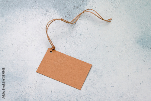 Brown paper label on string