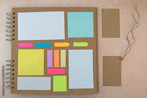 Coloured square paper on brown paper