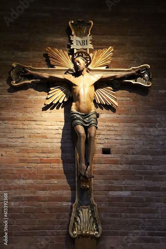 The large wooden crucifix on the southern wall. The Abbey of Nonantola. Modena, Italy.