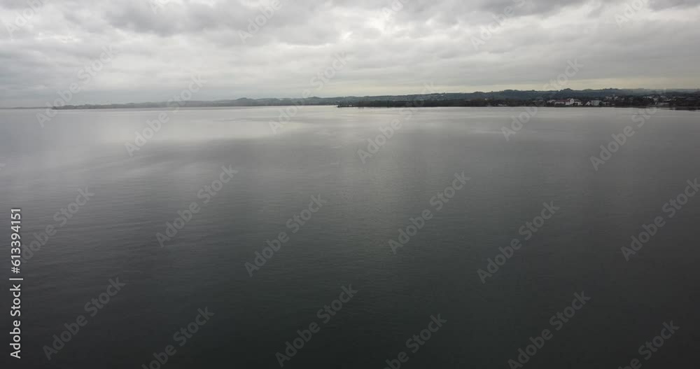 Aerial view of Lake Constance, a happy cloudy autumn day, in the background the country of Germany and forest on the shores, Bregenz, Vorarlberg, Austria, Europe Aerial view of Lake Constance, a happy cloudy autumn day, in the background the country of Germany and forest on the shores, Bregenz, Vorarlberg, Austria, Europe