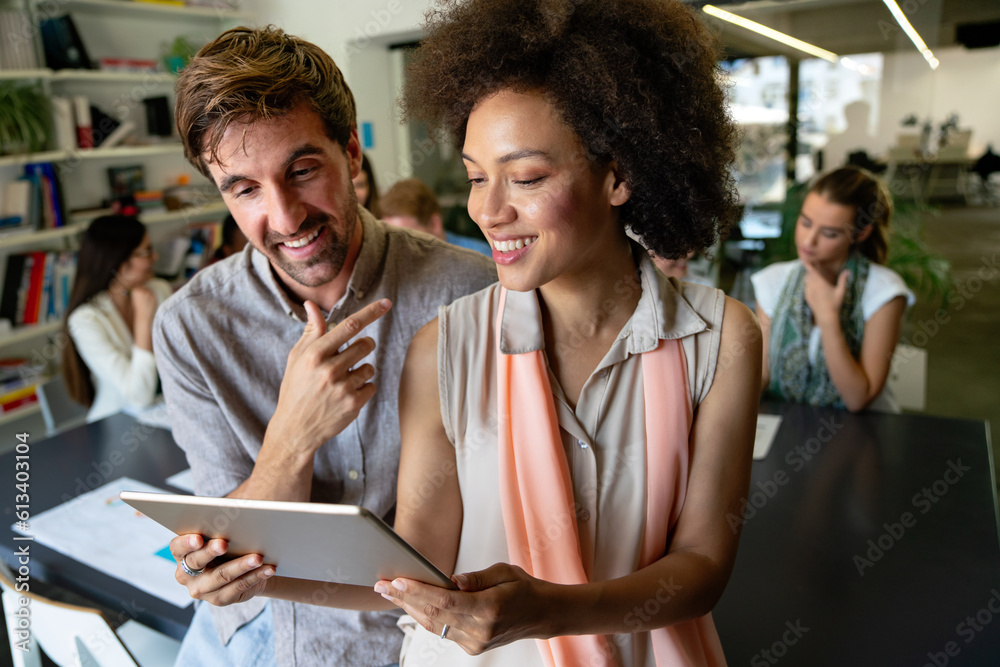 Fototapeta premium Group of happy multiethnic business people having fun and chatting at workplace office