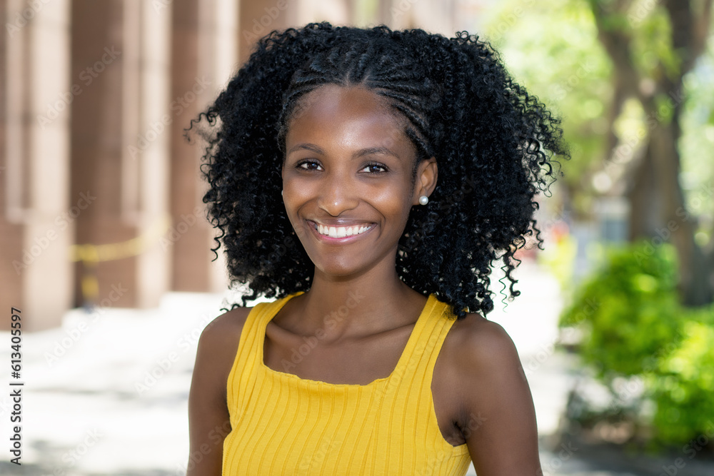 Fototapeta premium Portrait of laughing young black woman from Brazil