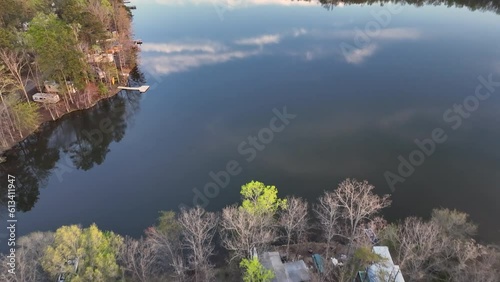 Aerial lake to campground resort Virginia afternoon reflection. Rural community Spotsylvania County, Virginia, near Fredericksburg. American Civil War battleground. Summer recreation cabins and boats. photo