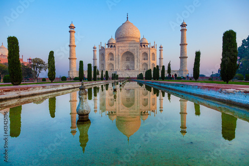 Taj Mahal in morning light with the inscription of the coran in arabic letter meaning in english: This is an invitation to live on Earth as a good Muslim,