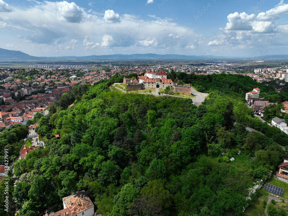 Aerial view of the Citadel of the Guard, a 16th-century hilltop fortress crowning the landscape of Brasov, Romania.