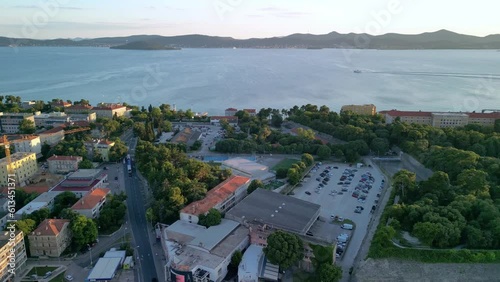 An aerial panorama in sunset hours over Zadar, peninsula, Kolovare, islands Ugljan and Osljak, marina Jazine, Obala Penza Branimira. Croatia. photo