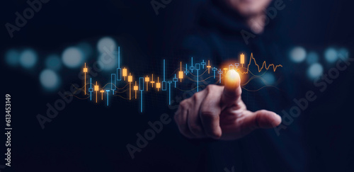 Stock market, planning and strategy, Business growth, progress or success concept. Hand of Businessman or trader touching showing a growing virtual hologram stock on interface, invest in trading.