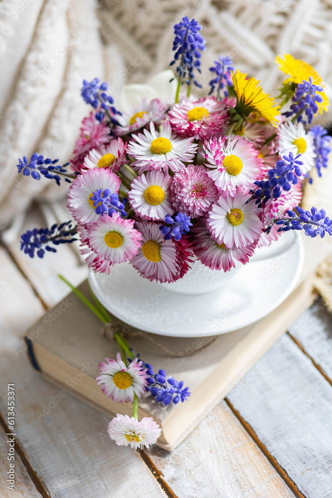 Bouquet of daisy with pink flowers in a ceramic white mug, wooden background. Romantic still life, summer or spring inspiration, cozy home decor. Greeting card for birthday, anniversary, Mother's Day Bouquet of daisy with pink flowers in a ceramic white mug, wooden background. Romantic still life, summer or spring inspiration, cozy home decor. Greeting card for birthday, anniversary, Mother's Day