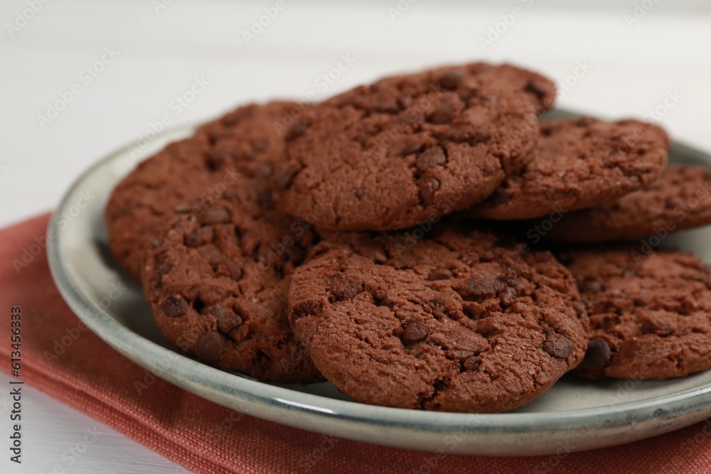 Delicious chocolate chip cookies on white table, closeup Delicious chocolate chip cookies on white table, closeup