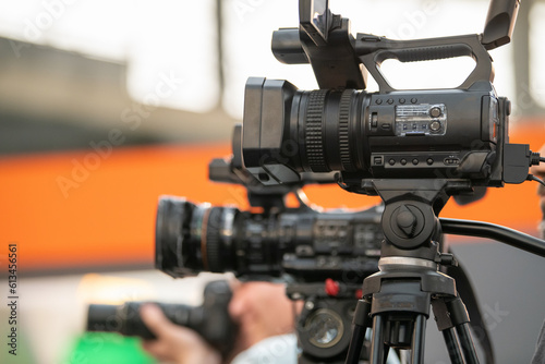 Close-up shot reveals a camera capturing the essence of technology at a Technology Trade Show, showcasing innovation and creativity.