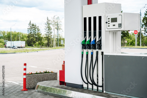 Gas station. Pistols with gasoline and diesel fuel at a car gas station. Oil business and transportation costs