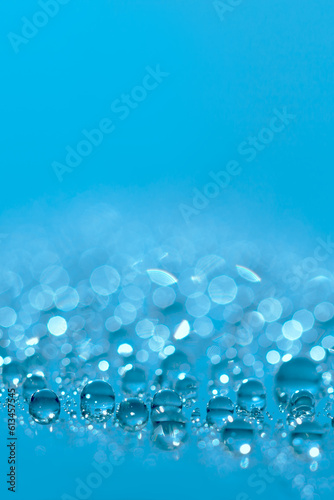 Water drops.Blue glitter shiny background. Defocused background water drops. Blurred bokeh background.