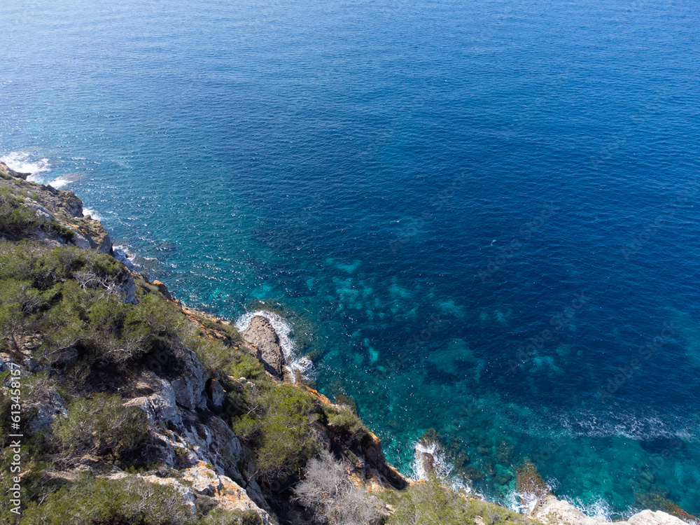 Beautiful rocky shore of Mallorca Island, Balearic Islands, Spain. High cliffs, blue sea. 