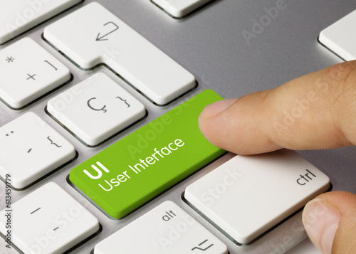 UI User Interface .- Inscription on Green Keyboard Key..