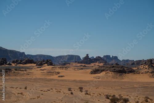 view in the Sahara desert of Tadrart rouge tassili najer in Djanet City ,Algeria.colorful orange sand, rocky mountains