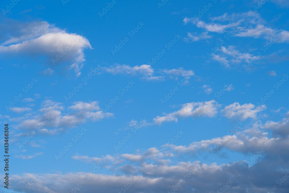 white fluffy clouds standing out against a blue sky white fluffy clouds standing out against a blue sky