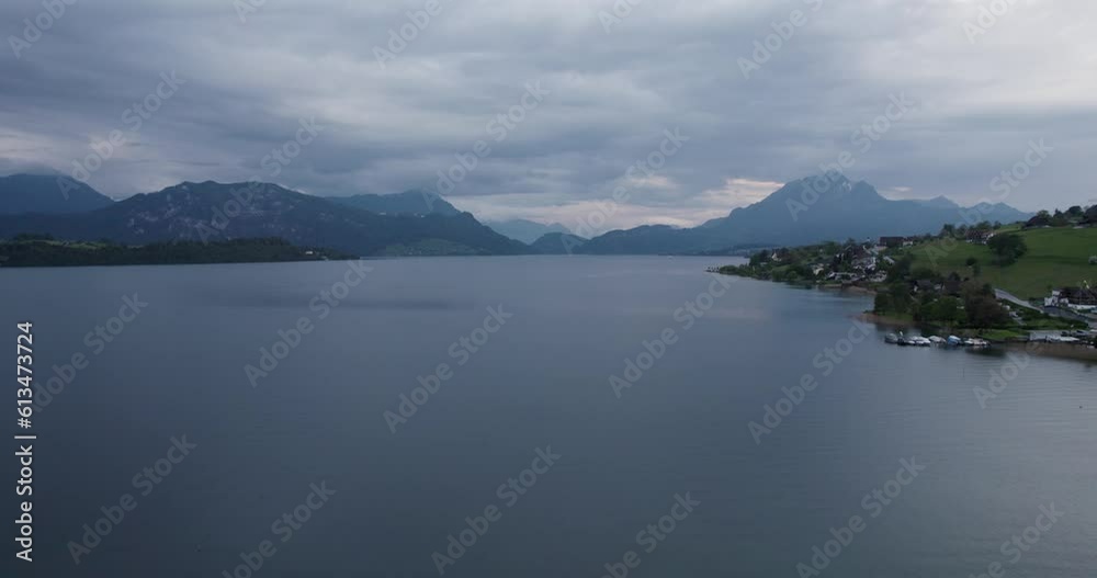 Stunning Swiss Lake Of Lucerne On A Cloudy Day With Mountains In Distance In Switzerland. aerial Stunning Swiss Lake Of Lucerne On A Cloudy Day With Mountains In Distance In Switzerland. aerial