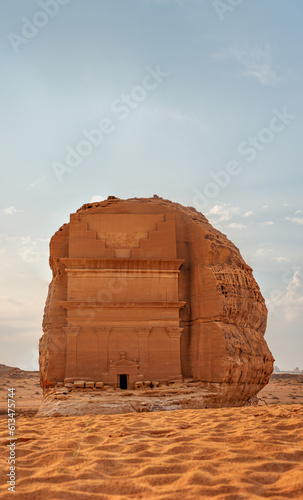 Tomb Lihyan Son of Kuza or Qasr al-Farid at Hegra, Saudia Arabia - most popular landmark in Mada'in Salih archaeological site, sandy desert landscape around photo