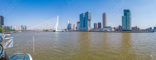 View over the Maas river to the city center of Rotterdam with Erasmus bridge during the day