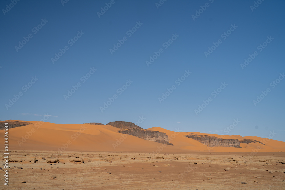 view in the Sahara desert of Tadrart rouge tassili najer in Djanet City  ,Algeria.colorful orange sand, rocky mountains