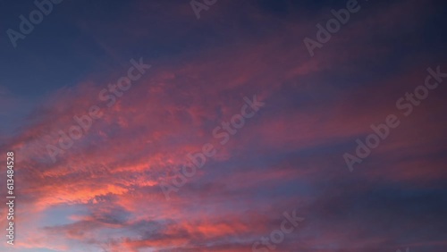 Intense cirrostratus of fire-colored clouds move across the sky photo