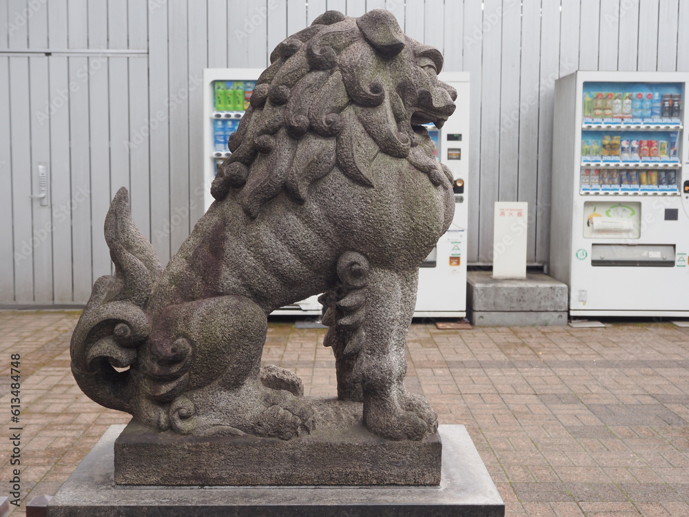 TOKYO, JAPAN June 8, 2023 Komainu (liondog) statue at a Shinto