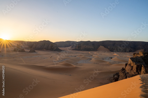 view in the Sahara desert of Tadrart rouge tassili najer in Djanet City ,Algeria.colorful orange sand, rocky mountains