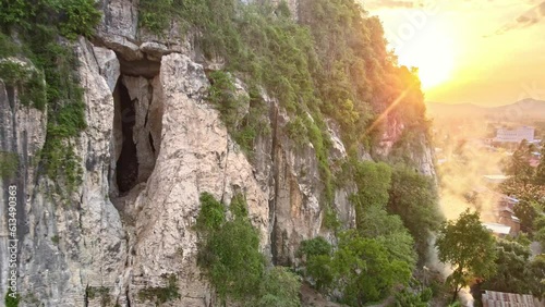 Drone shots of bats leaving their cave at sunset (Bat Exodus) in Battambang, Cambodia