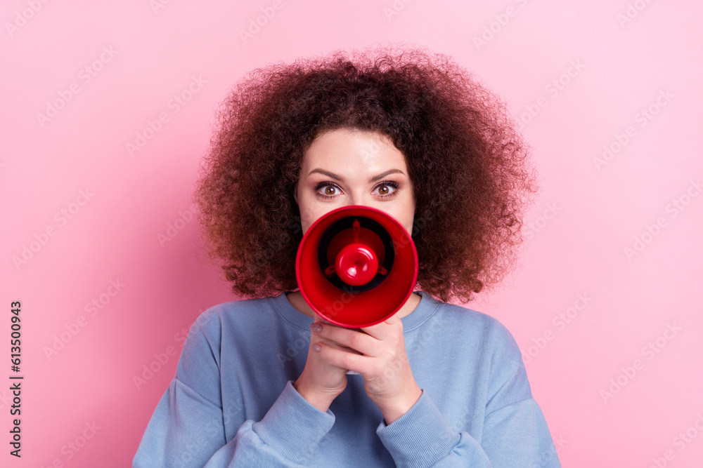 Obraz premium Portrait photo of young excited positive girl hold megaphone screaming announce new collection sneakers isolated on pink color background