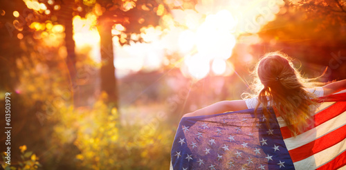 Independence Day - Little Girl With Usa American Flag - Freedom Concept - Defocused Abstract Sunset, Flare Effect And Motion Blur